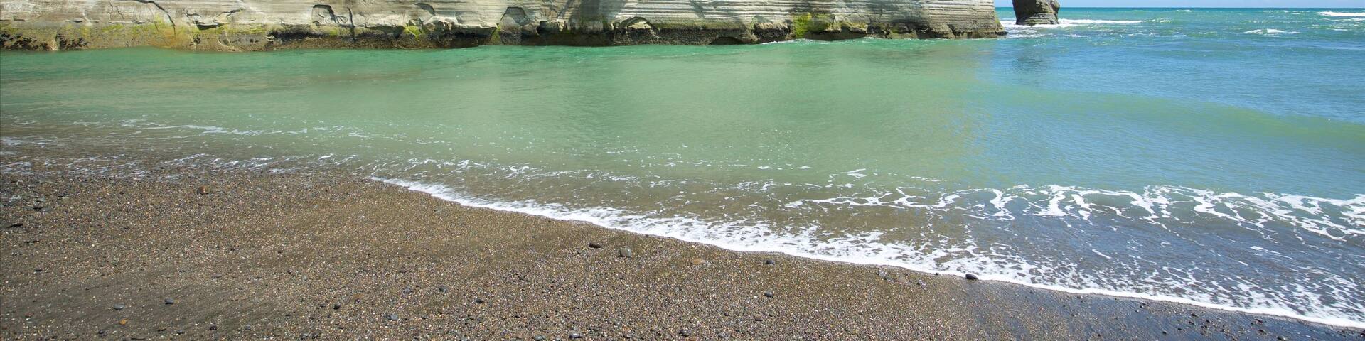 Urenui featuring rugged coastline, general coastal views and a pebble beach