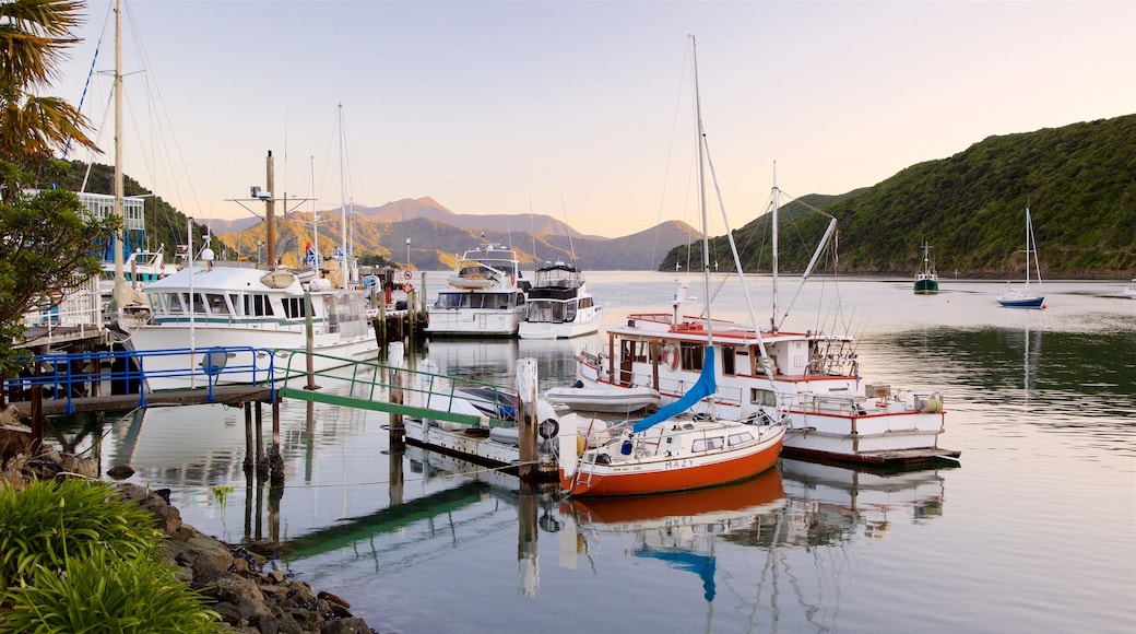 Picton Harbour featuring a sunset and a marina