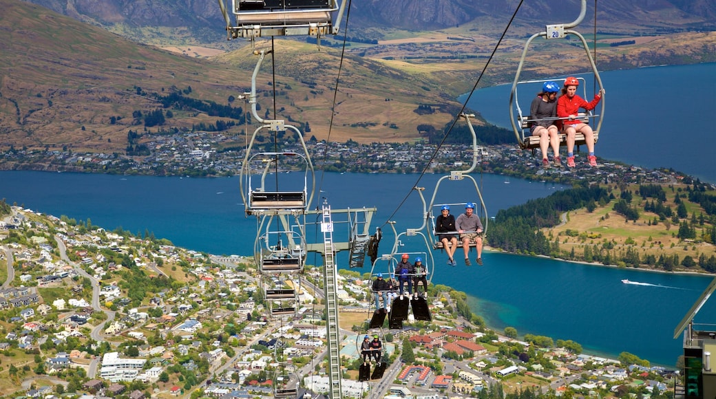 Skyline Gondola featuring a gondola, a small town or village and a lake or waterhole