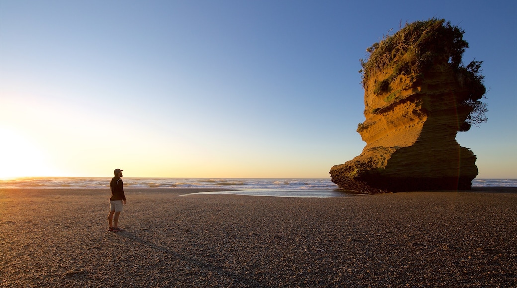 Punakaiki which includes a sunset and general coastal views