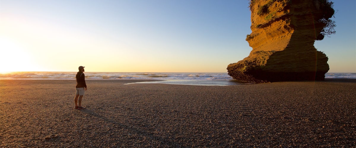 Punakaiki featuring general coastal views and a sunset