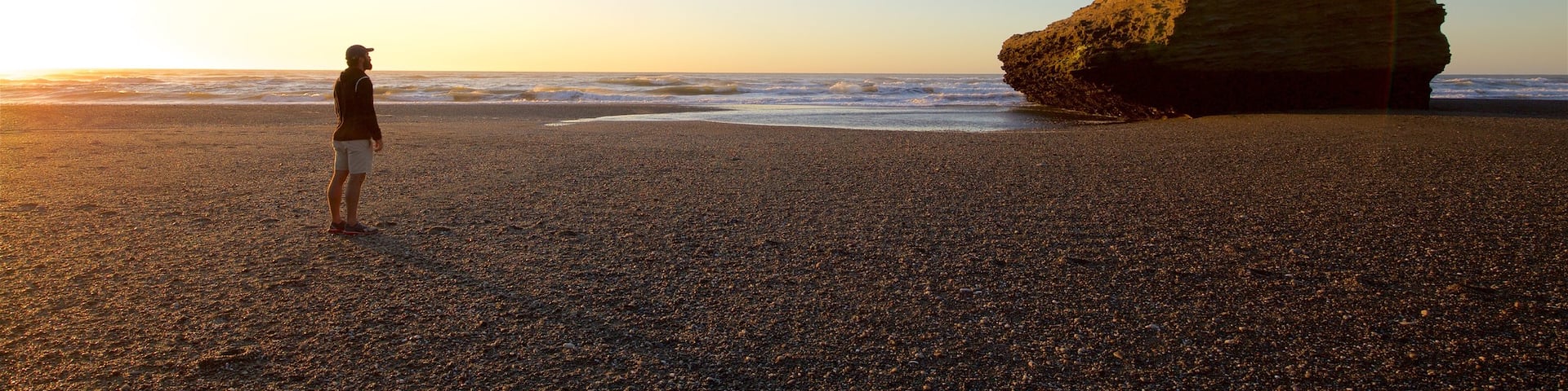 Punakaiki which includes a sunset and general coastal views