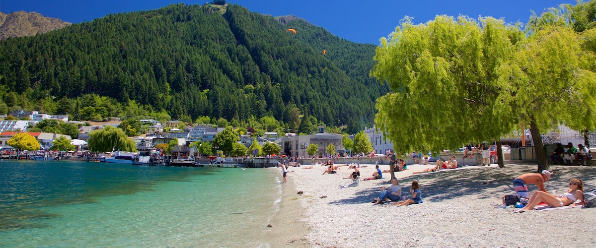 Queenstown Beach featuring a small town or village, a pebble beach and a lake or waterhole