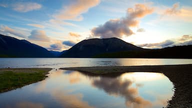 Tasman Region which includes a sunset and a lake or waterhole