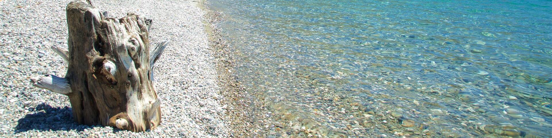 Lake Hawea featuring mountains and a lake or waterhole