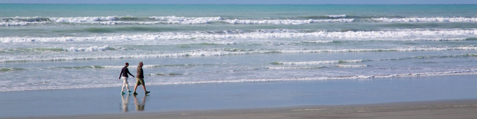 Westport featuring waves and a beach