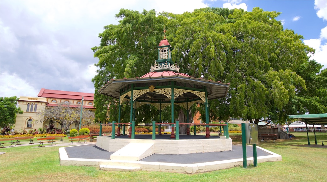 Queens Park featuring heritage architecture and a garden