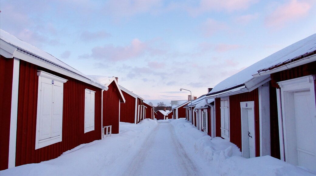 Gammelstad featuring snow, a small town or village and a sunset