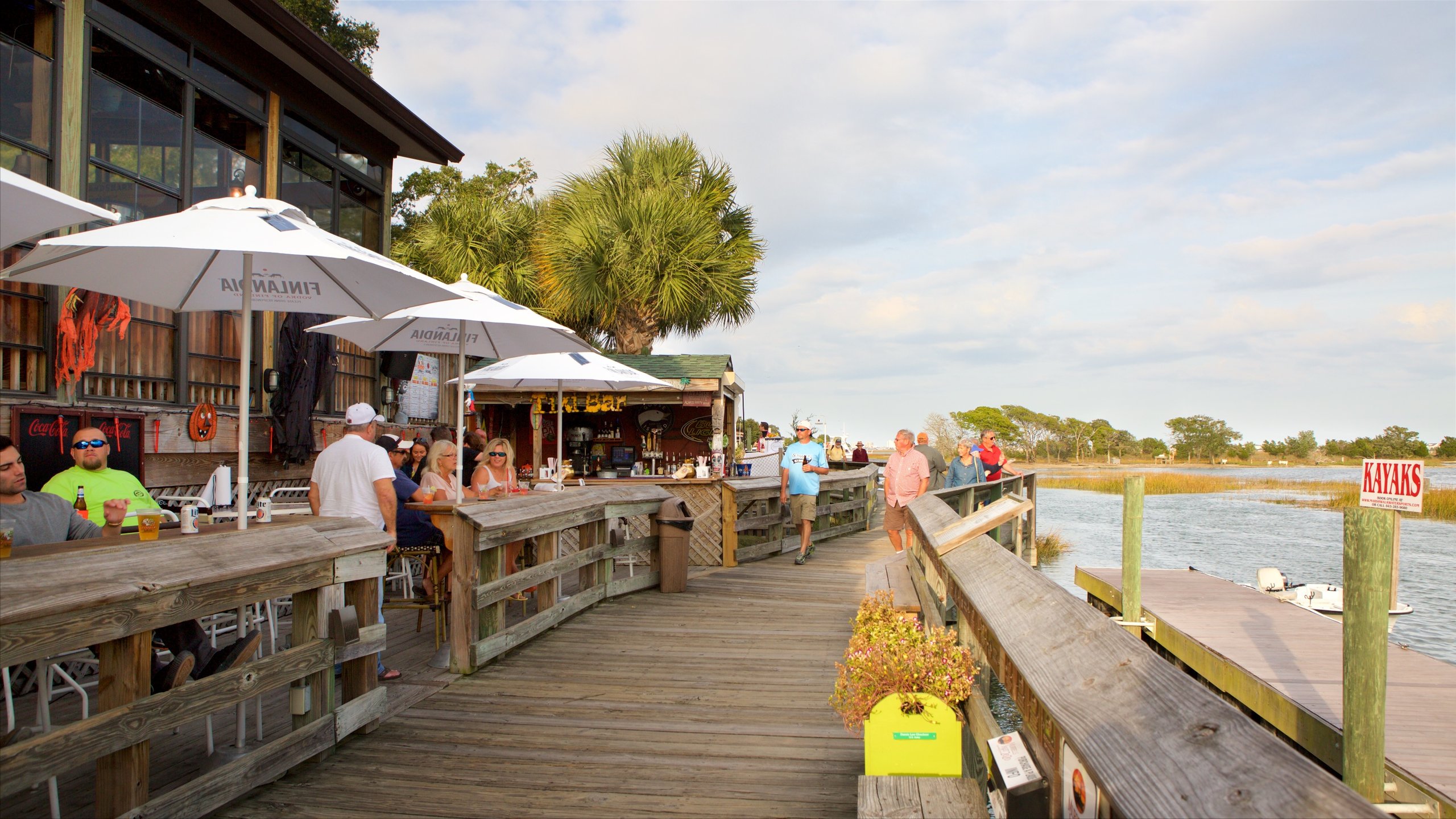 Murrells Inlet which includes outdoor eating and wetlands as well as a small group of people