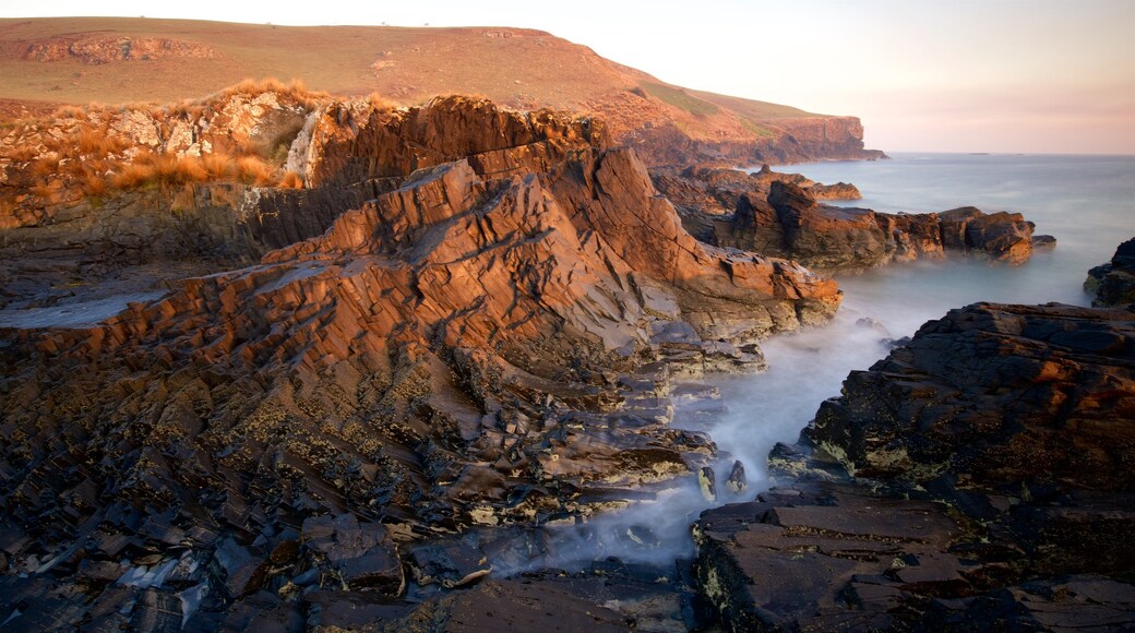 Perkins Bay showing rocky coastline, general coastal views and a sunset