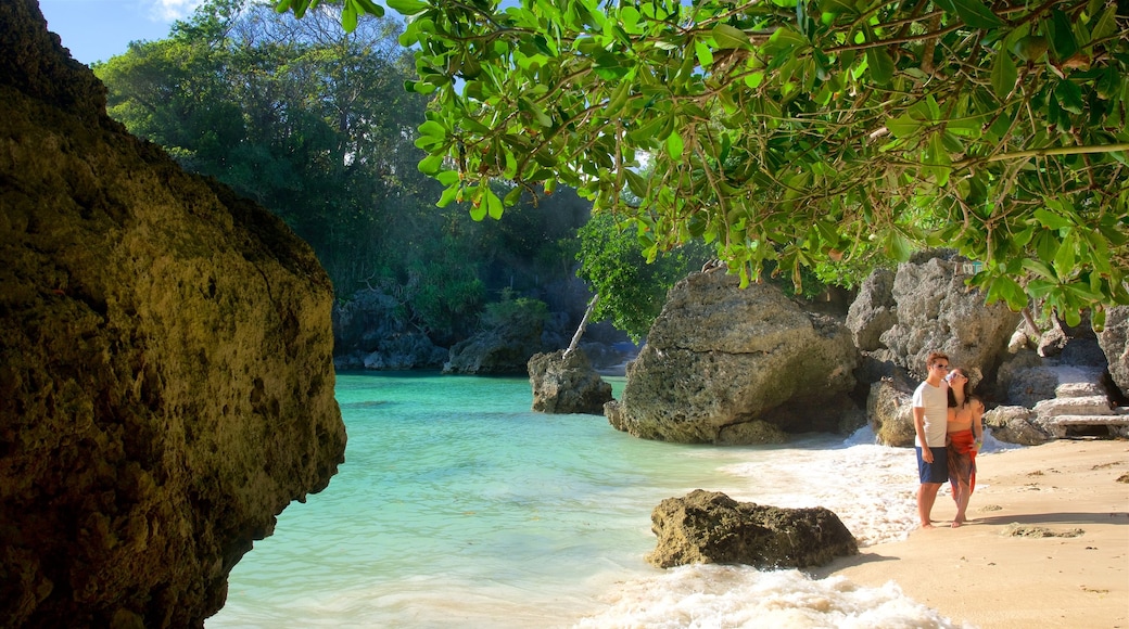 Balinghai Beach showing tropical scenes, a bay or harbor and a beach