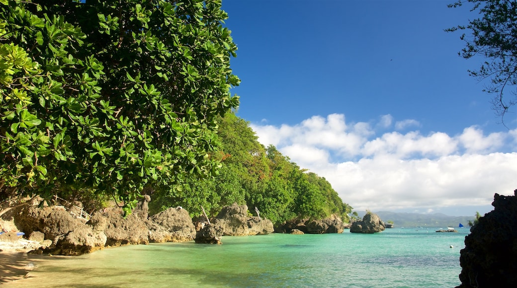 Balinghai Beach showing tropical scenes, rugged coastline and a bay or harbour