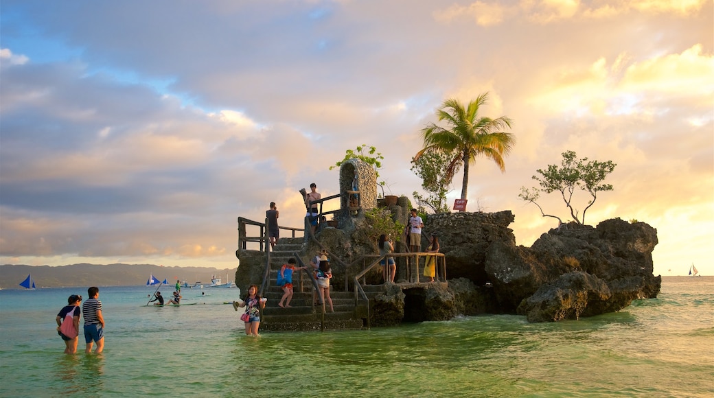 Willy\'s Rock which includes tropical scenes, a sunset and swimming