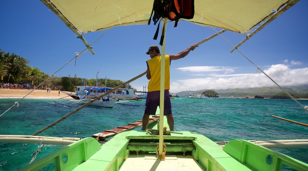 Crystal Cove Island showing tropical scenes, kayaking or canoeing and general coastal views