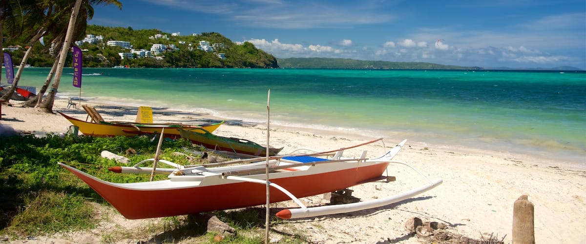 Visayan montrant scènes tropicales, kayak ou canoë et plage de sable