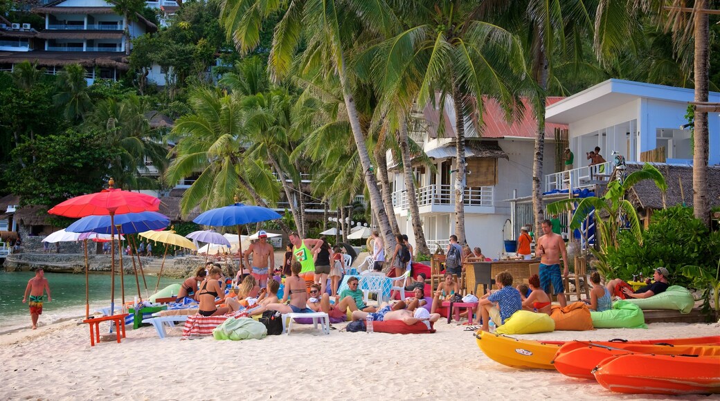 Aklan montrant plage de sable, scènes tropicales et ville côtière