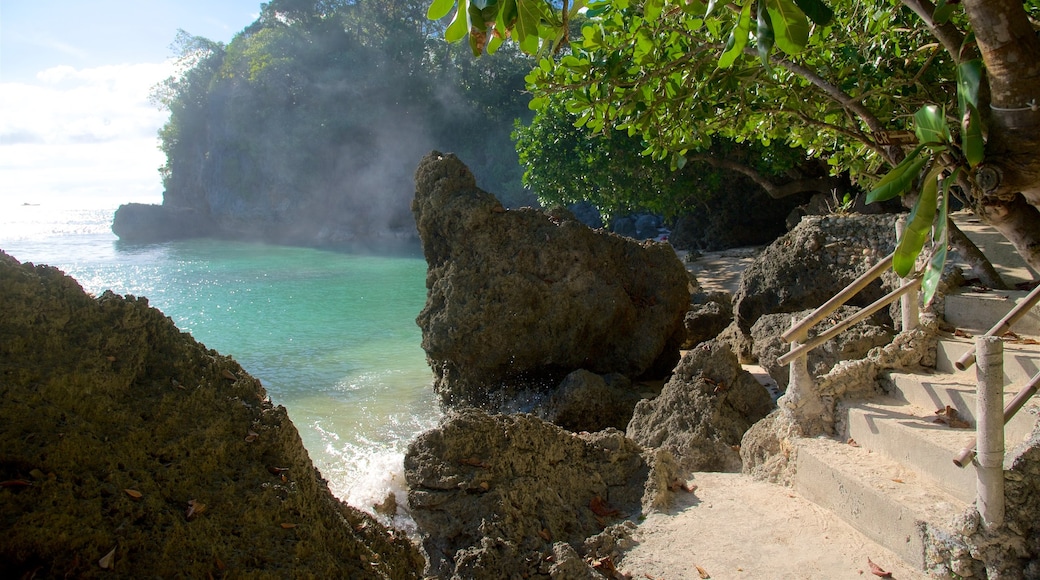 Balinghai Beach showing a bay or harbour, tropical scenes and rugged coastline