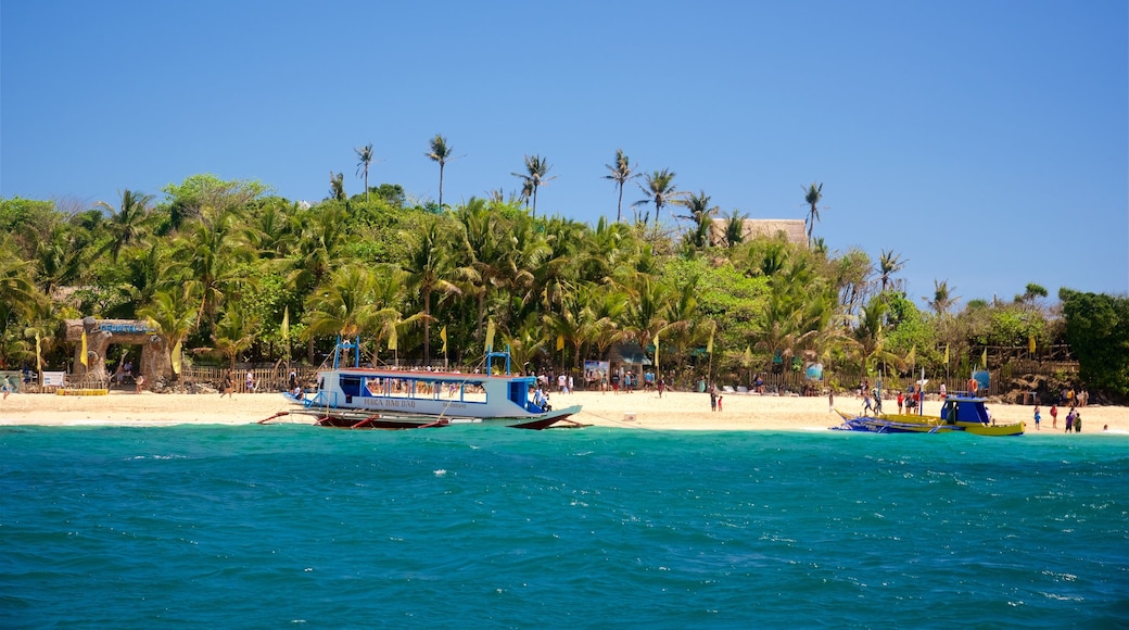 Crystal Cove Island showing a sandy beach, island views and a ferry