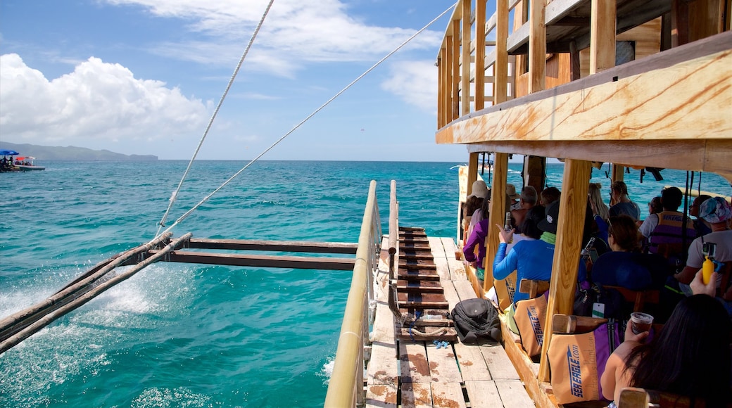 Ariels Point featuring surf and boating as well as a large group of people