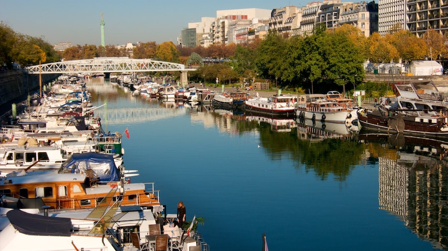 Paris which includes a marina, a bridge and a river or creek