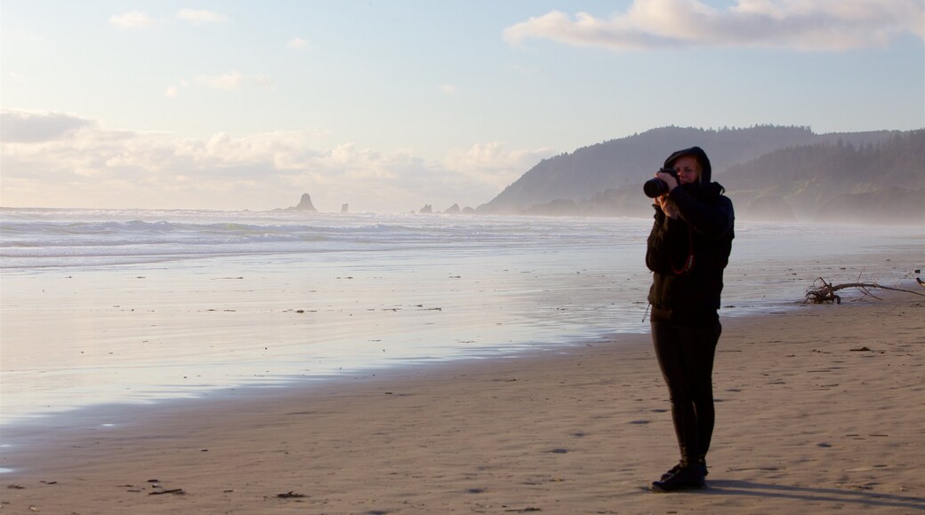 Cannon Beach featuring a sandy beach and general coastal views as well as an individual femail