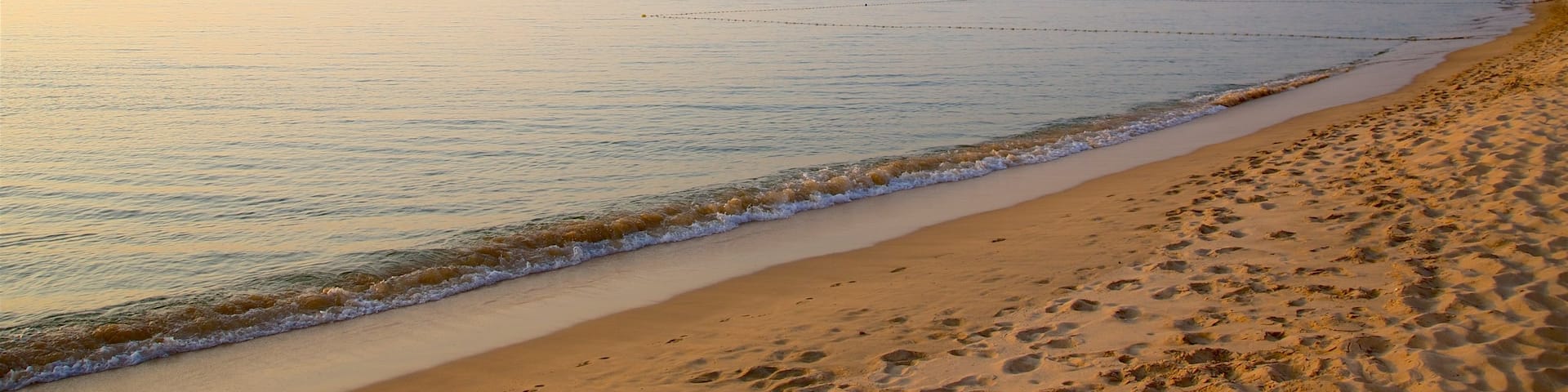 Phu Quoc Island which includes a beach, general coastal views and a sunset