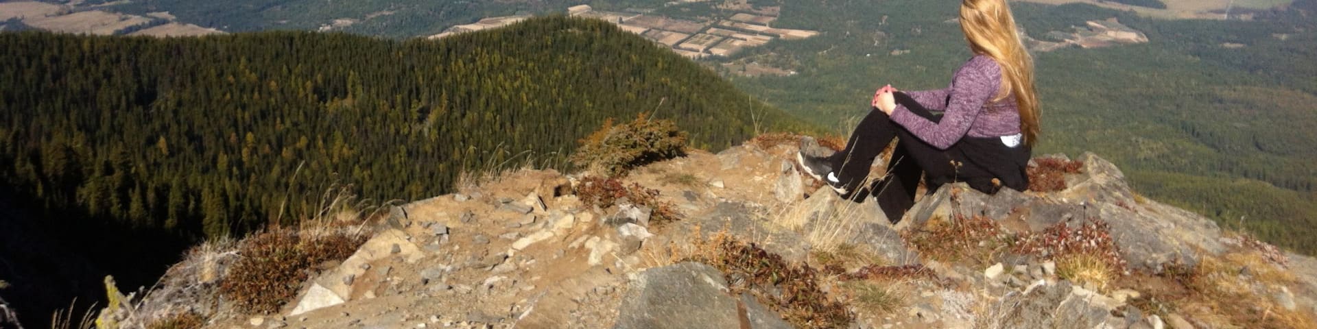 Bonners Ferry showing mountains as well as an individual femail