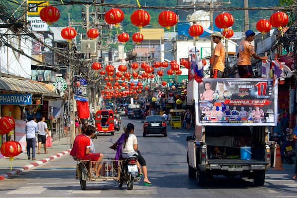 Bangla Night Street which includes signage as well as a small group of people