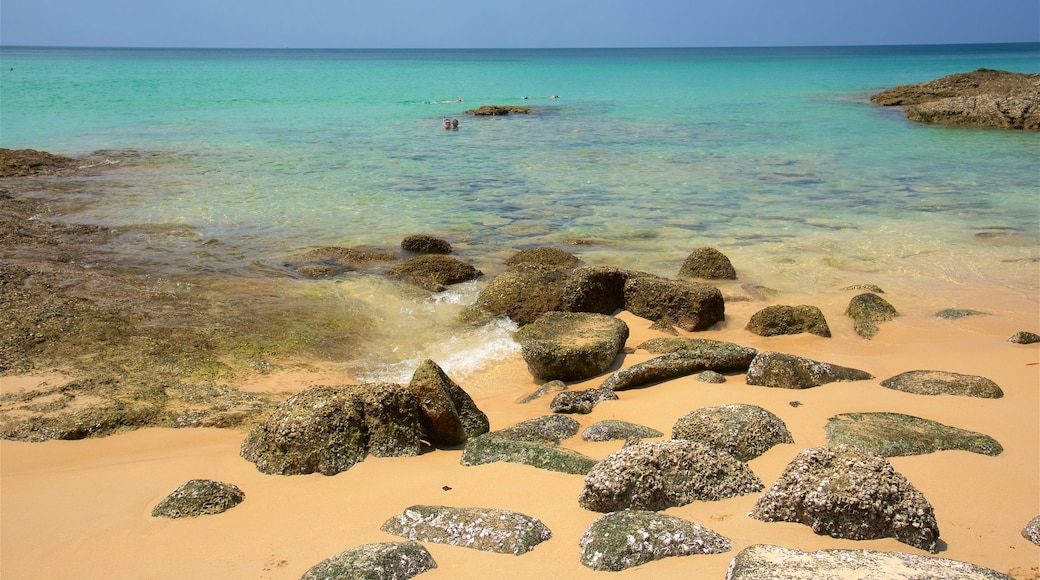 Surin Beach which includes a bay or harbour, a beach and rocky coastline