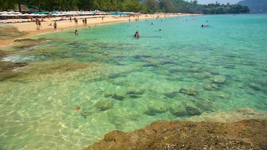 Surin Beach showing a sandy beach, rocky coastline and swimming