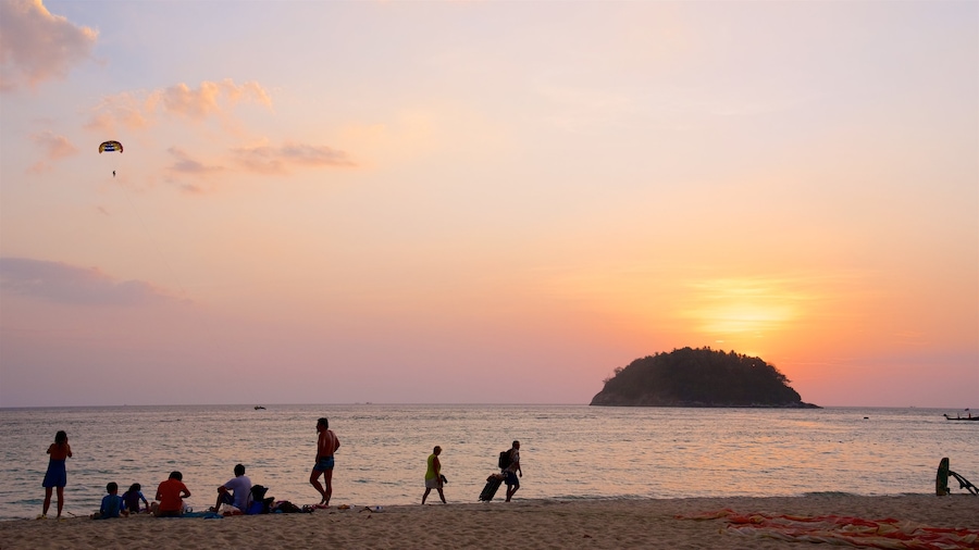 Kata Beach showing a bay or harbour, a sunset and a sandy beach