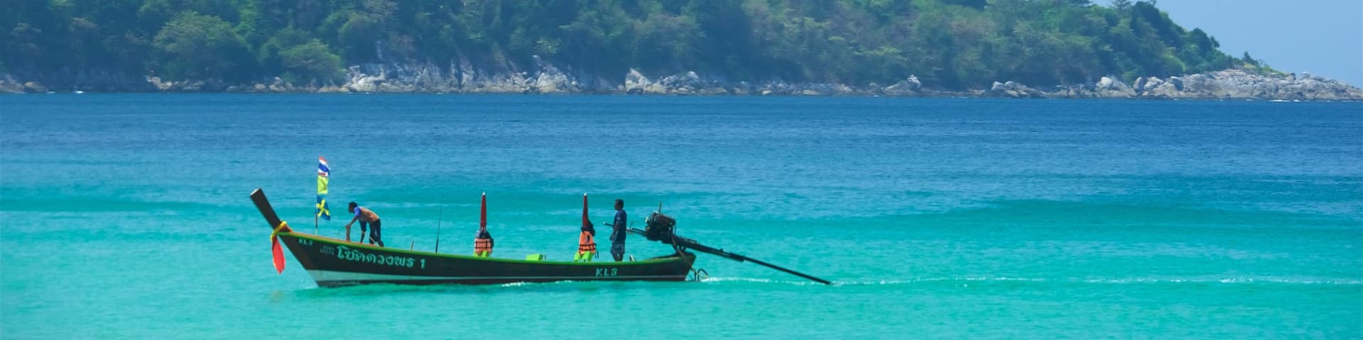 Kata Noi Beach which includes rocky coastline, boating and a bay or harbor