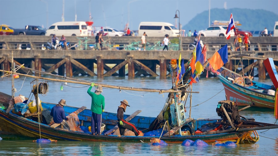Nathon Pier showing a bay or harbor and boating as well as a small group of people
