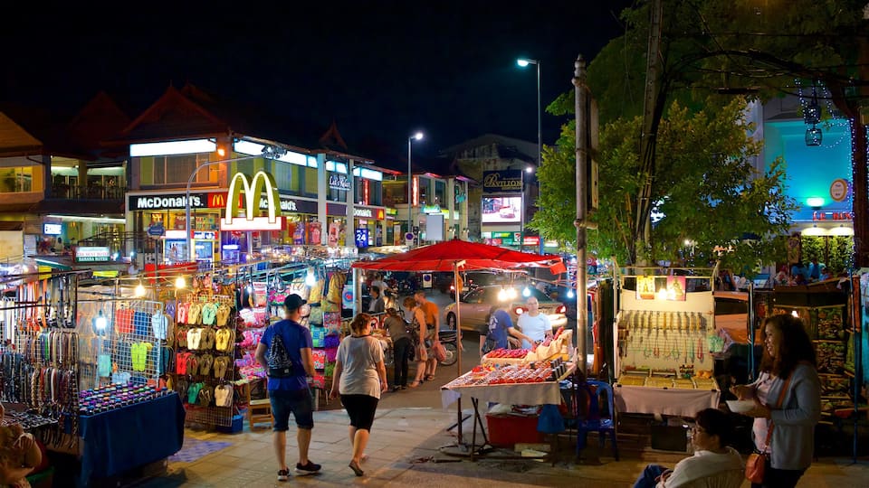 Chiang Mai Night Bazaar which includes markets, night scenes and street scenes
