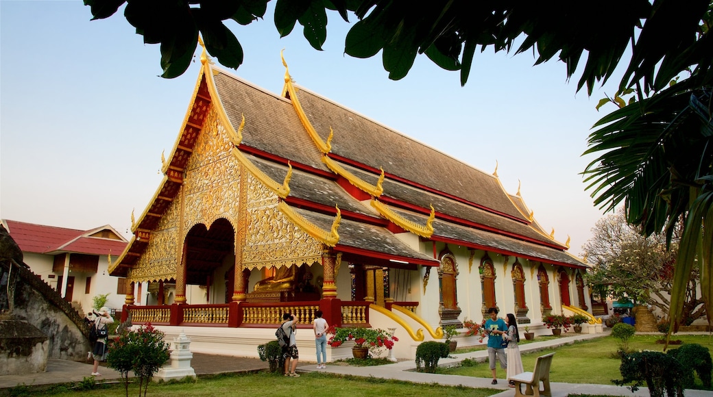 Wat Chiang Man which includes a temple or place of worship as well as a small group of people