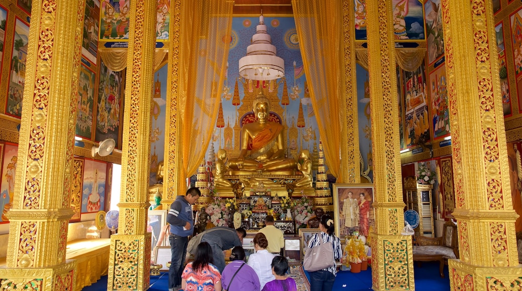 North Thailand featuring interior views and a temple or place of worship as well as a small group of people