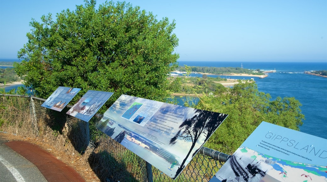 Lakes Entrance Lookout which includes signage and a bay or harbor