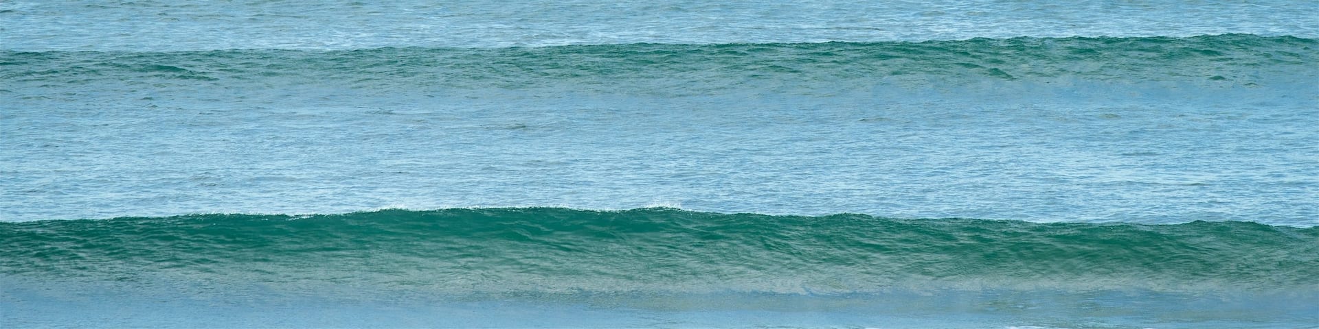 Phillip Island showing waves as well as an individual male