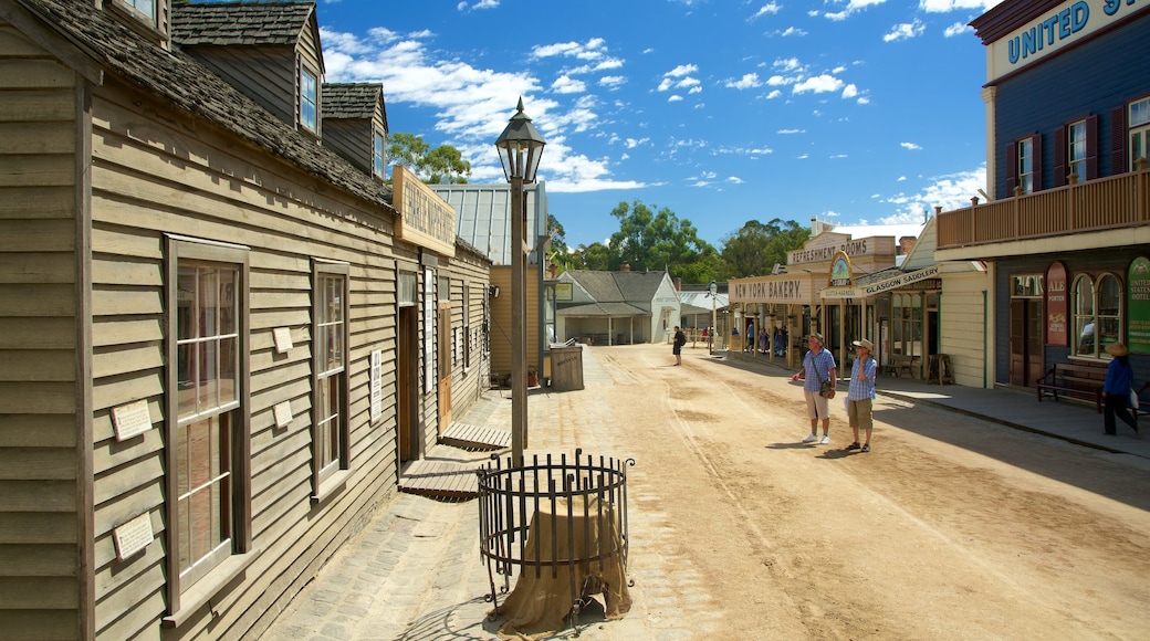 Sovereign Hill featuring heritage architecture and street scenes as well as a small group of people