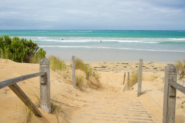 Warrnambool Beach which includes a bay or harbour, surf and a sandy beach