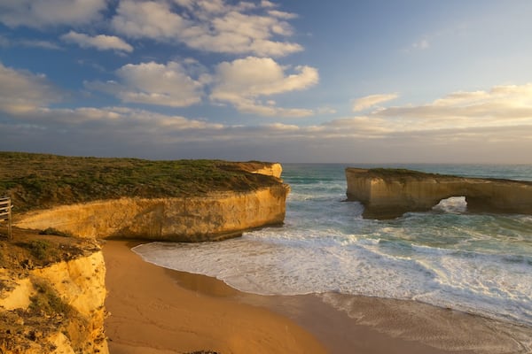 London Bridge which includes a sunset, a beach and general coastal views