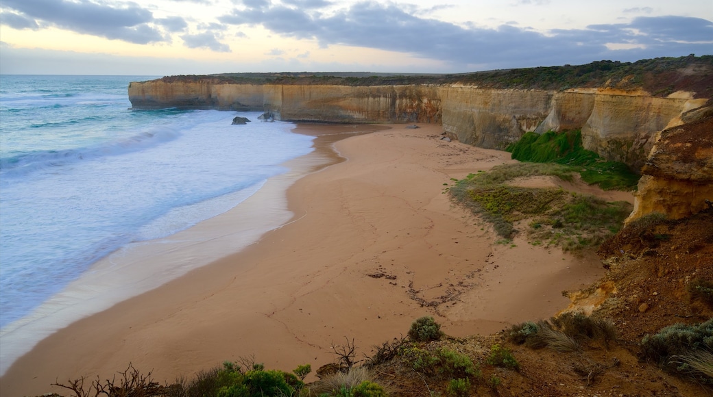 London Bridge showing a beach, surf and a sunset