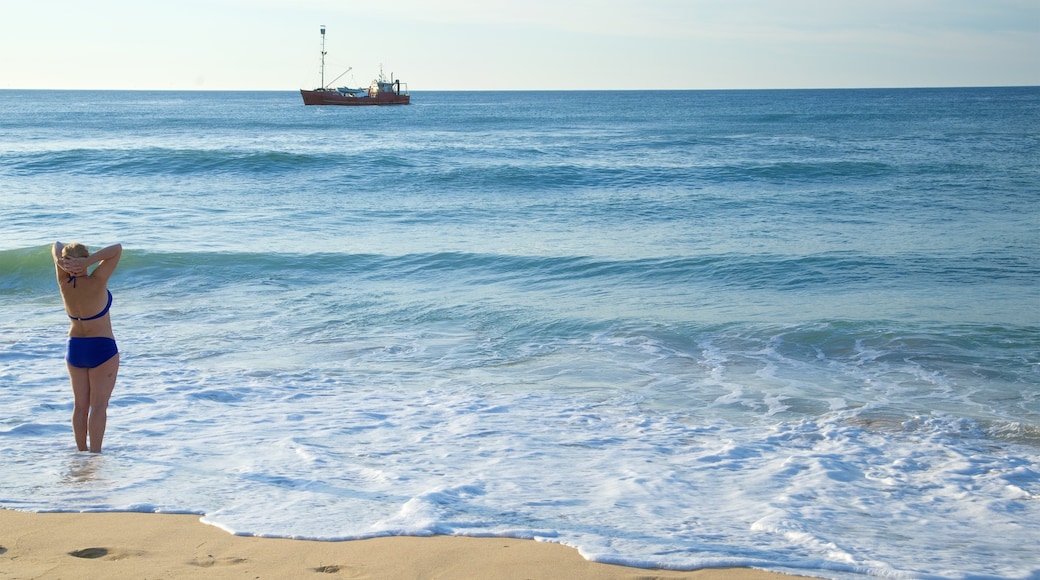 Gippsland featuring boating, a sandy beach and a bay or harbour