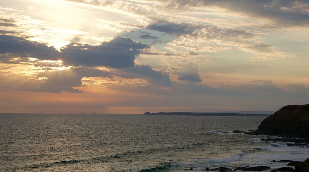 Phillip Island featuring a sunset, a bay or harbour and rugged coastline