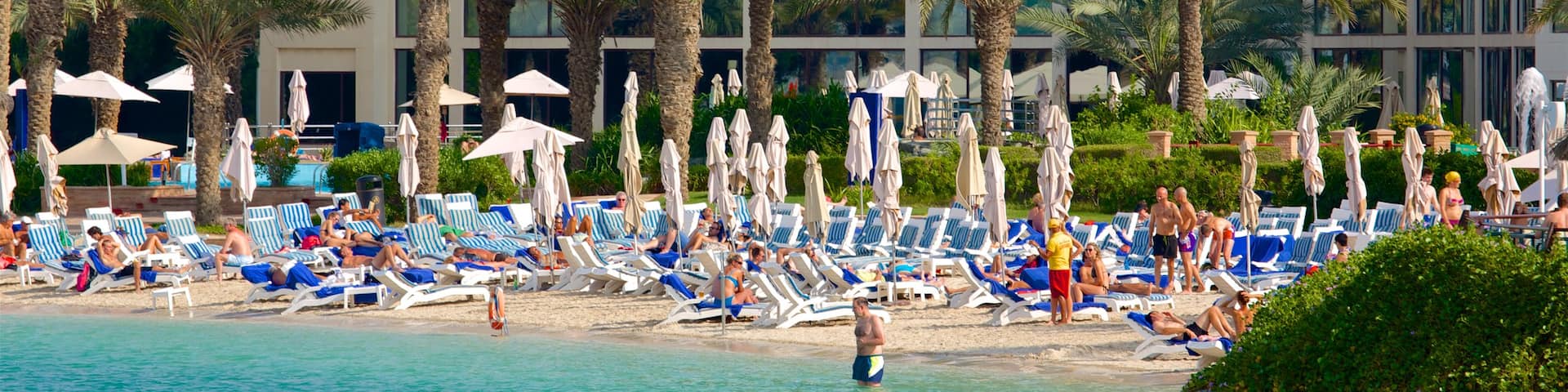 Al Danah featuring swimming, a beach and a hotel