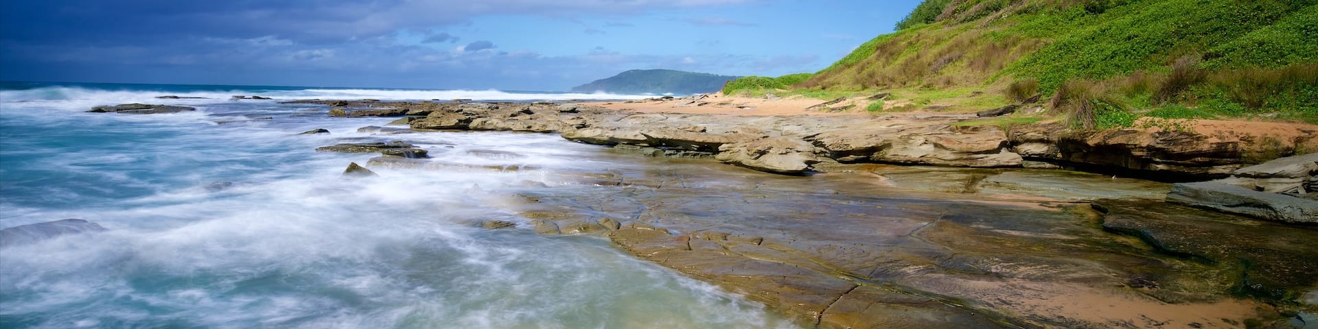 Central Coast featuring rugged coastline, a bay or harbour and waves