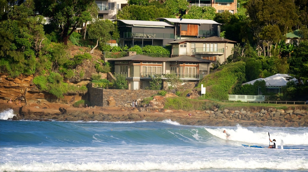 Avoca Beach showing rocky coastline, surf and a bay or harbour