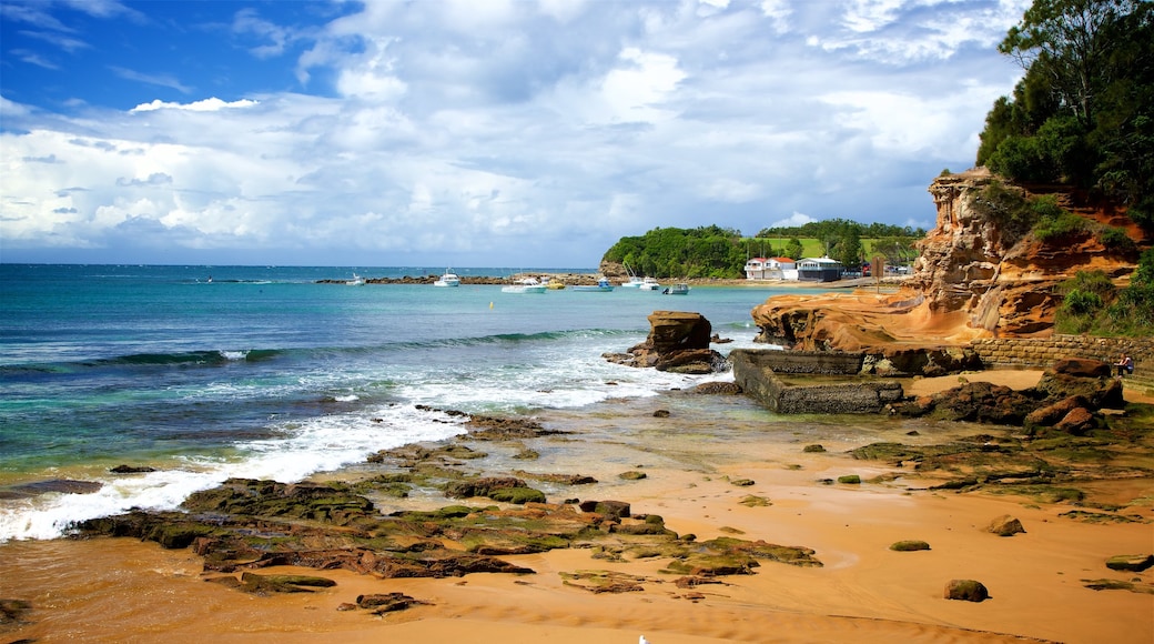 Terrigal showing a beach, a bay or harbour and rugged coastline