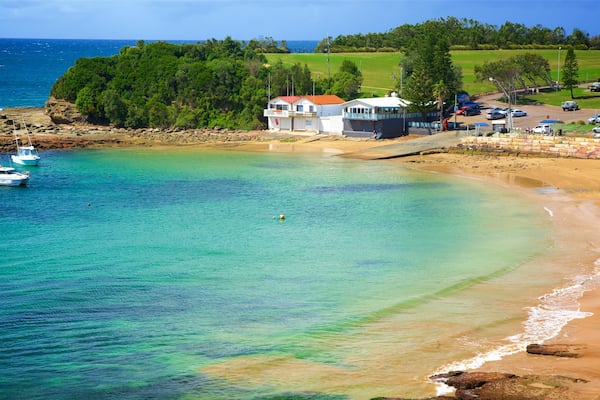 Terrigal which includes a bay or harbour and a beach