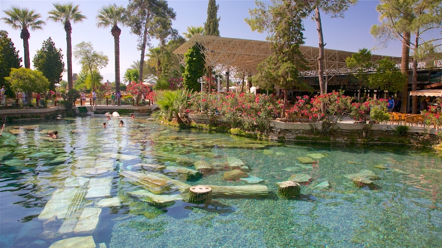 Hierapolis featuring a pool and a hot spring as well as a small group of people